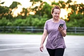 photo of mature woman walking for exercise