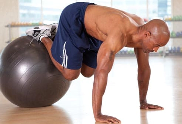 Abs and Legs: Knee Tucks