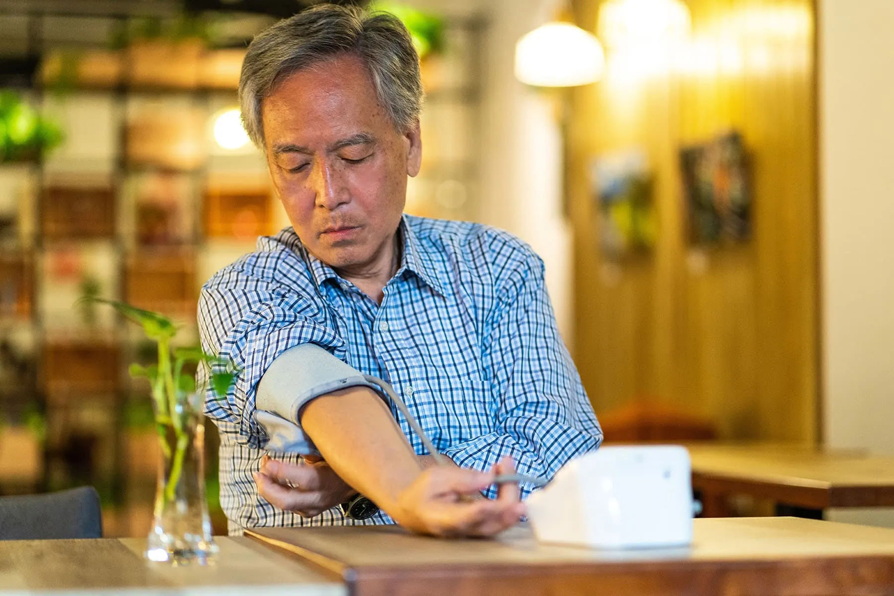 man checking blood pressure