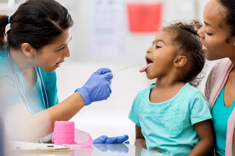 photo of child getting throat swabbed