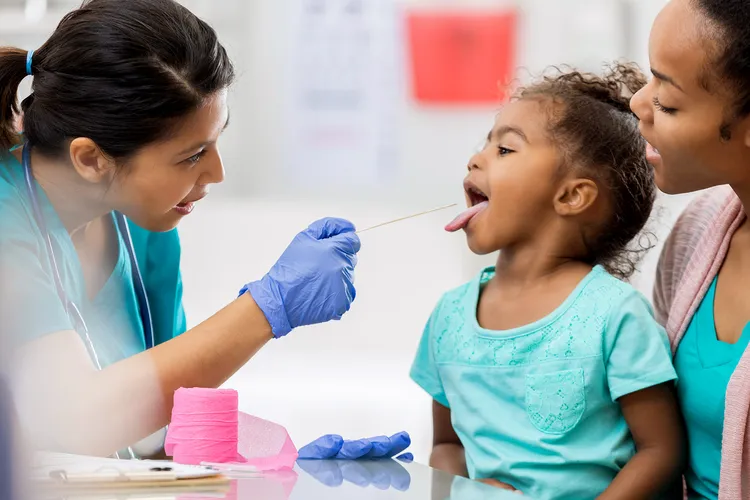 photo of child getting throat swabbed