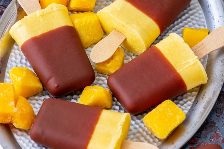 Chocolate-Dipped Mango Pops Chocolate-Dipped Mango Pops