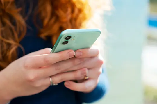 photo of woman using phone
