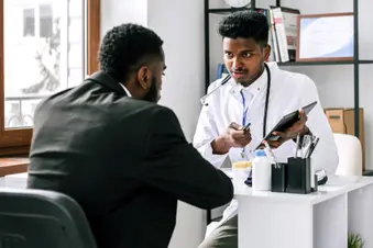 photo of doctor and patient talking