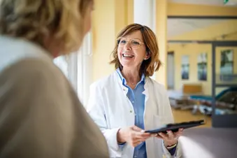 photo of doctor holding tablet