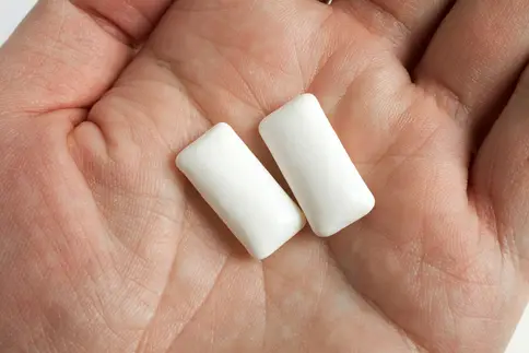 photo of pieces of gum in hand