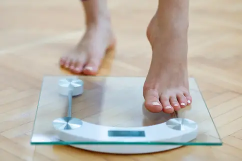 photo of stepping on scale