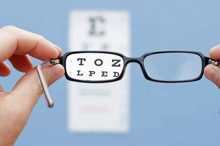 photo of glasses and eye chart