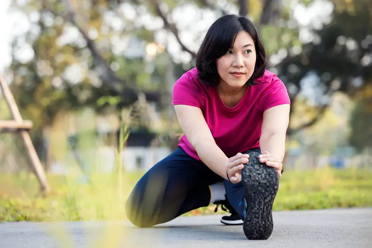 photo of stretching outdoors before run