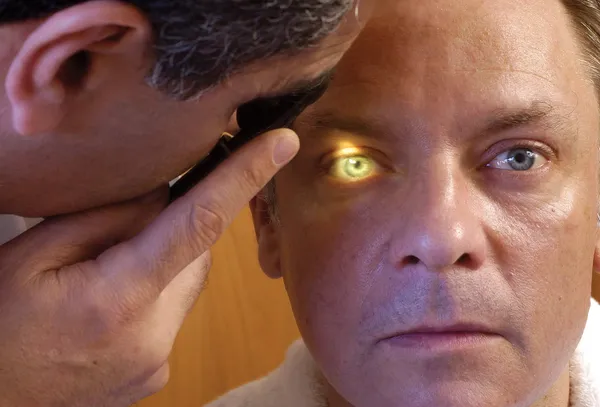 man getting opthalmology exam