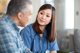 photo of palliative care specialist with patient