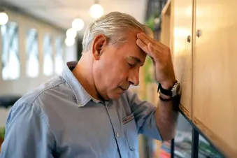 photo of senior man feeling tired