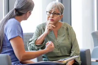 photo of senior woman talking with doctor