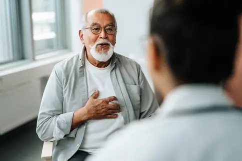 photo of senior man talking with doctor