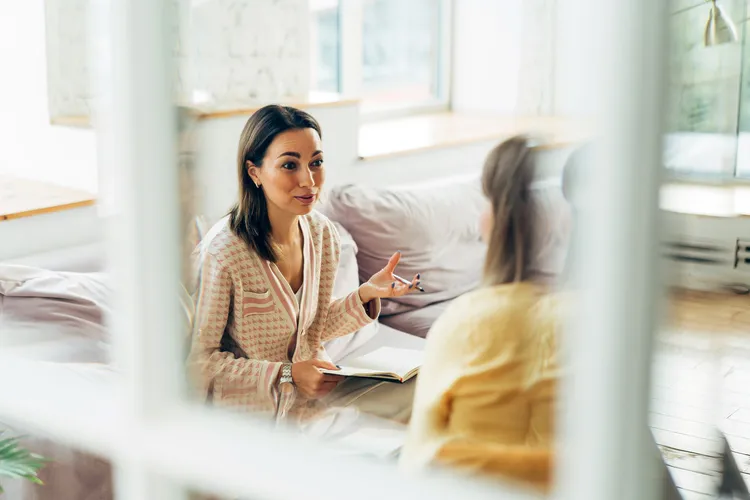 photo of woman talking to specialist