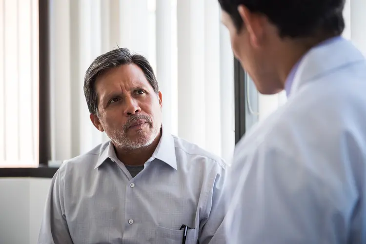 photo of patient listening to doctor