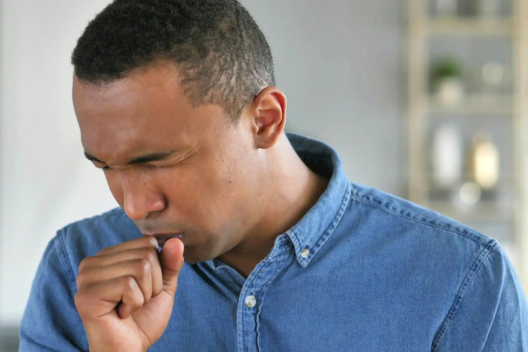 man coughing