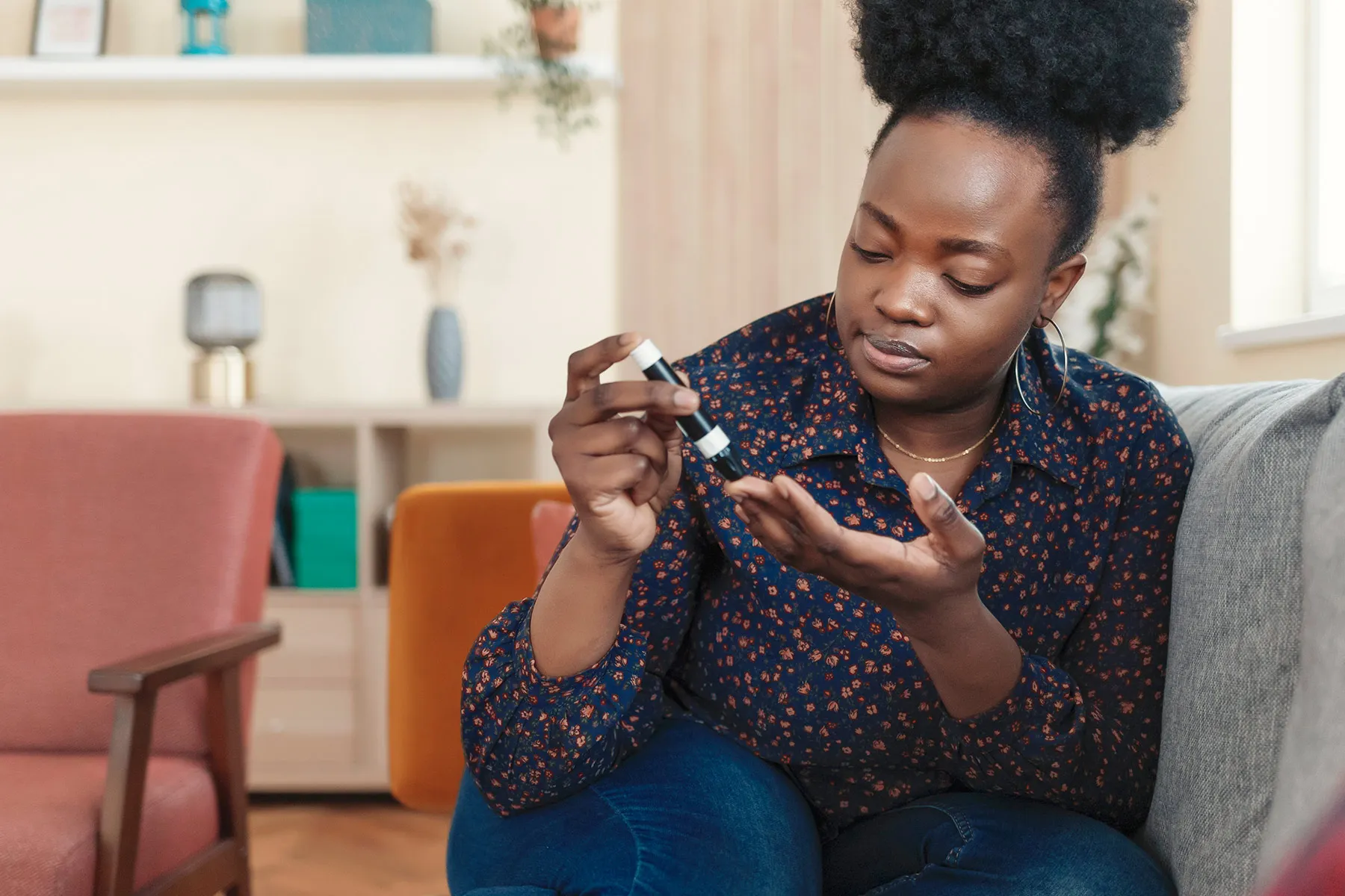 photo of woman checking blood glucose