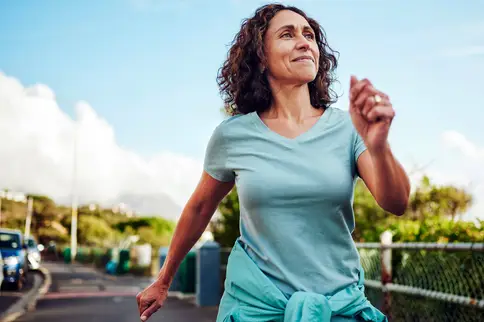 photo of mature woman on morning power walk