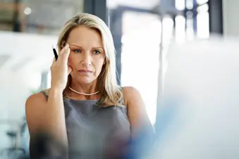 photo of mature businesswoman with stress headache