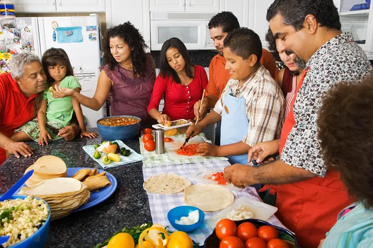 photo of large family preparing meal