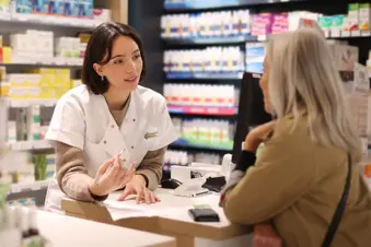 photo of pharmacist talking to woman