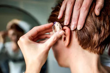 Hearing aids can help with hearing loss caused by age, trauma to your ear, medication, viral illness, or other issues.(Photo Credit: Moment/Getty Images)