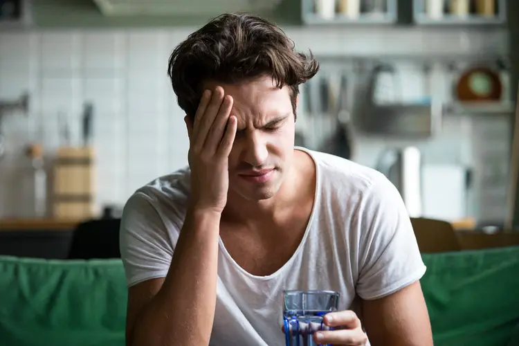 photo of man suffering from headache
