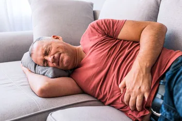 Peritonitis symptoms often start with belly pain that gets worse. You might also be bloated, from fluid buildup in your abdomen. (Photo credit: E+/Getty Images)