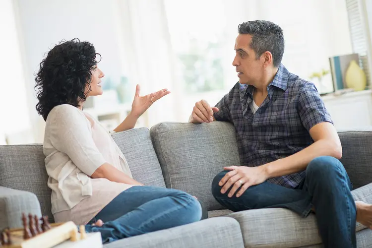 photo of mature couple arguing on sofa