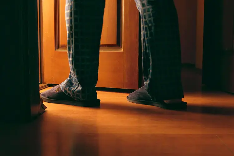 photo of man going to bathroom at night