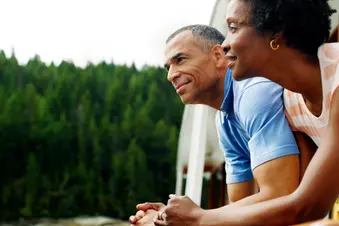 photo of mature couple relaxing on boat