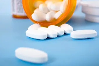 photo of prescription pills spilling from bottle