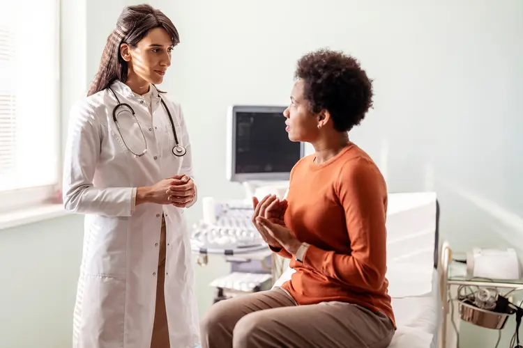 photo of doctor and patient talking