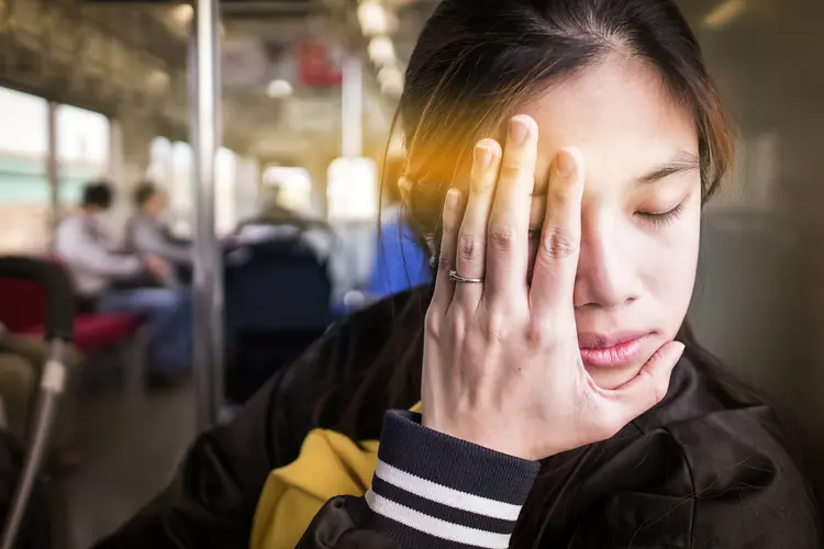 photo of woman with migraine