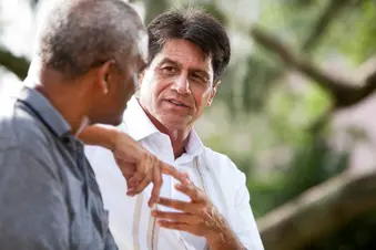 photo of friends having serious talk