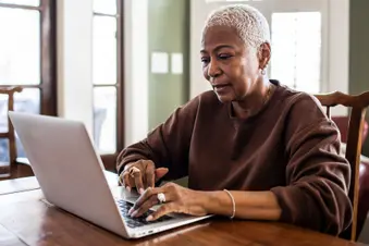 photo of older woman using laptop