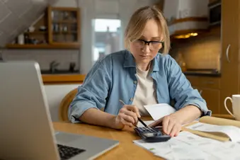 photo of woman calculating medical bills