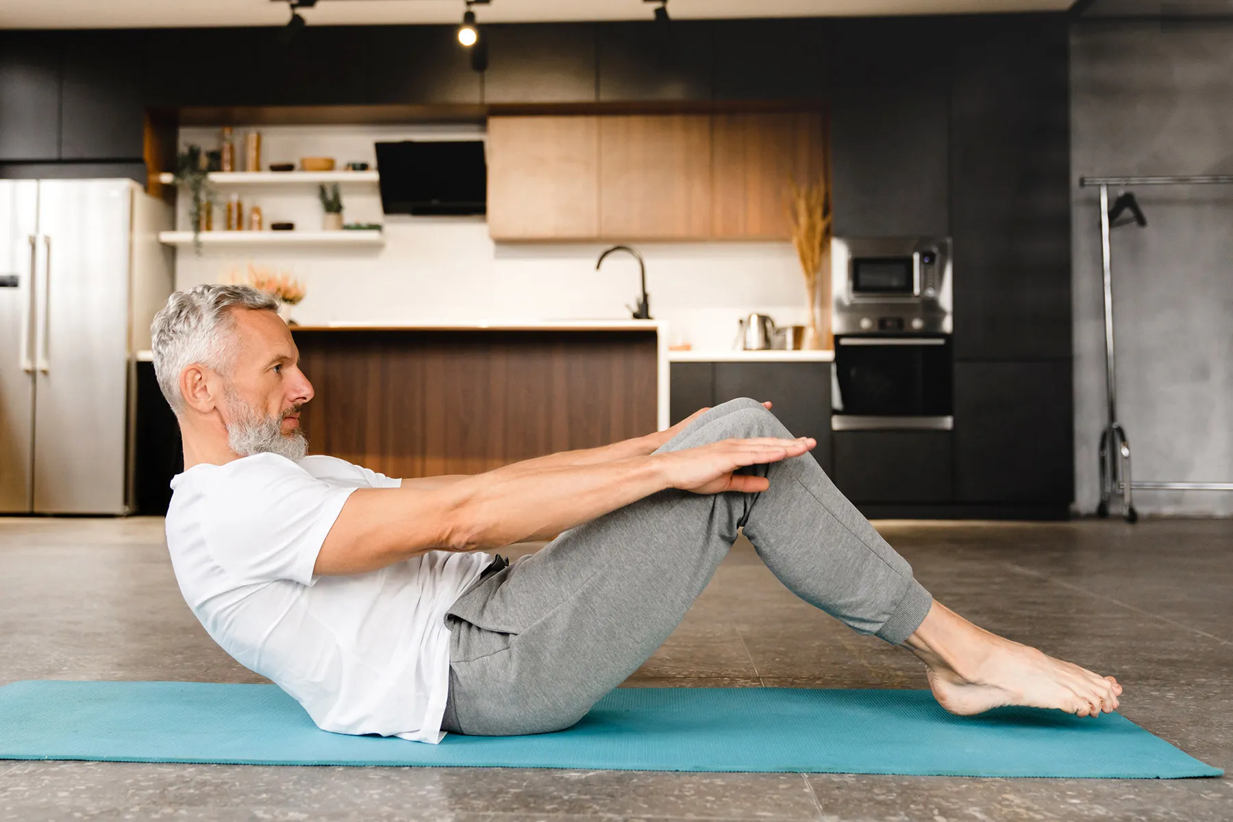 photo of stretching on mat at home