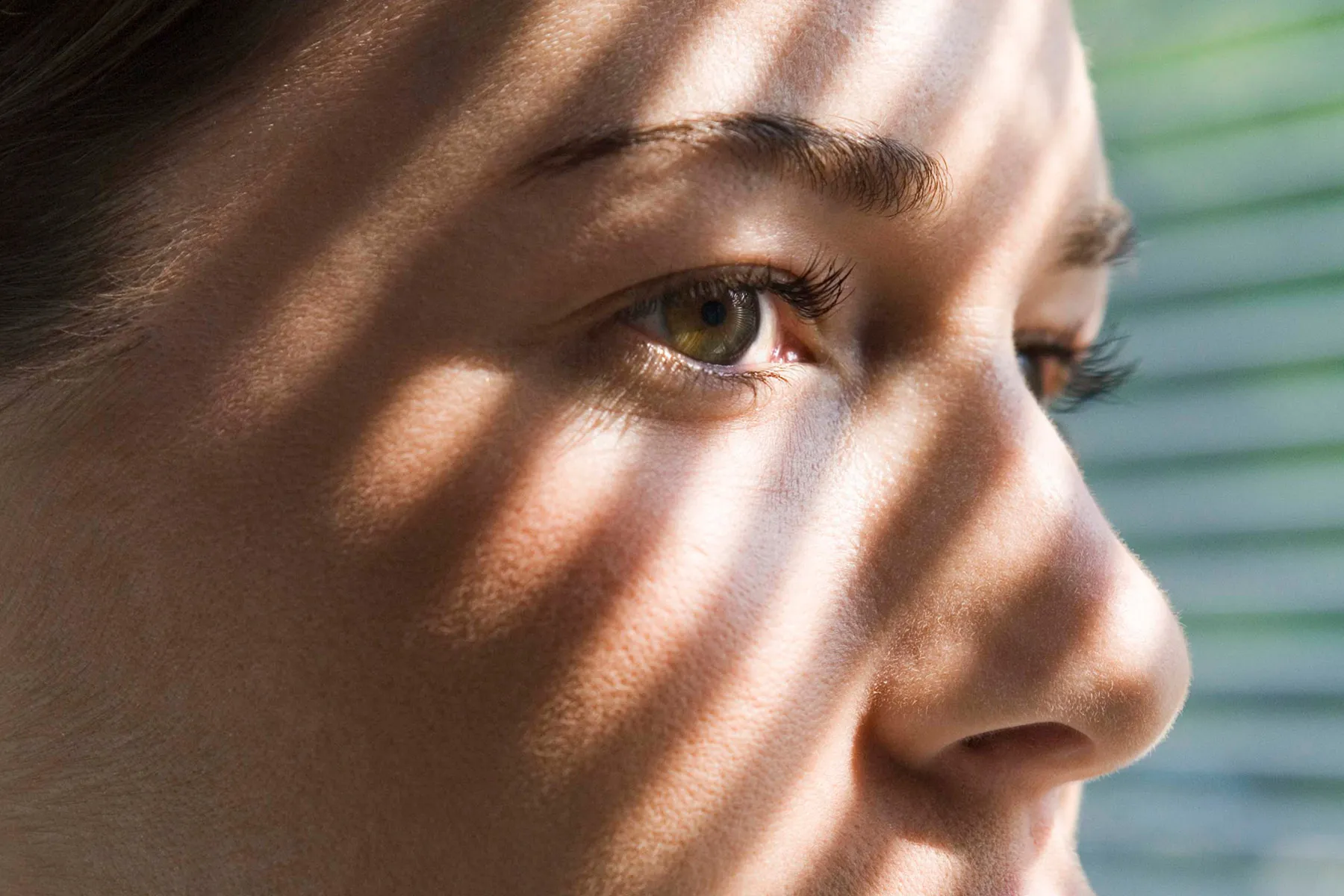 photo of anxious mother looking out window