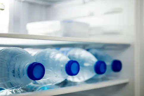 photo of bottled water in fridge