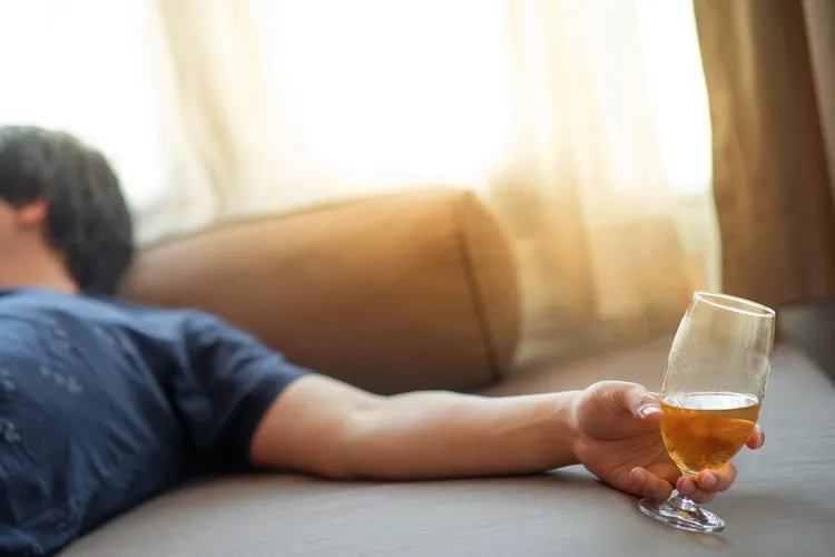 photo of man passed out after drinking