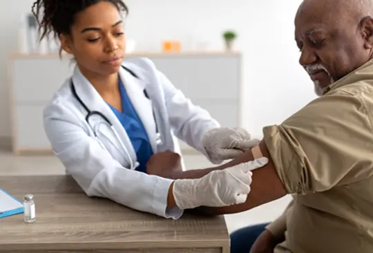 photo of senior man getting vaccination