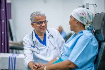 photo of oncology patient with doctor, smiling