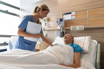 photo of senior male patient in hospital bed