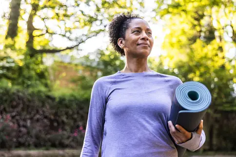 photo of older woman doing yoga
